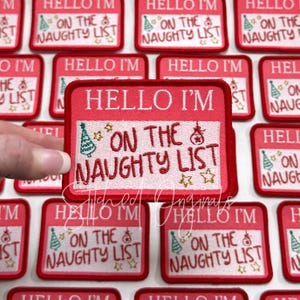 May include: A set of red and white iron-on patches with the text "Hello I'm on the naughty list" and a Christmas tree and ornament design.