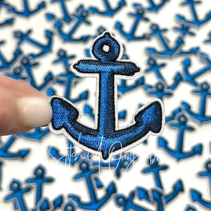 May include: A blue embroidered anchor patch with a white outline. The anchor is a popular nautical symbol and is perfect for adding a touch of maritime style to clothing, bags, or other accessories.