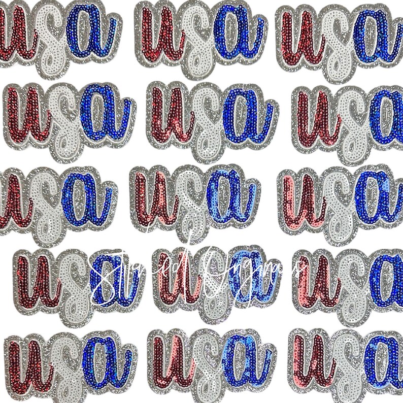 May include: A set of 15 iron-on patches featuring the word "USA" in red, white and blue sequins. The patches are ideal for adding a patriotic touch to clothing, bags or other crafts.