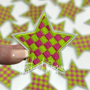 May include: A green and pink checkered star-shaped patch with a white outline. The patch is embroidered and has the text "Stitched Originals" in the lower right corner.