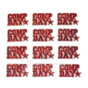 May include: A collection of red and silver sequined patches. Each patch features the words "COMP DAY" in a bold, stylized font, accompanied by a star. The patches are likely for apparel decoration.
