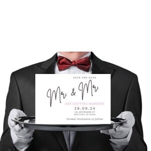 May include: Save the date card with a tuxedo-clad person holding a white card with black calligraphy that reads "Mr. & Mrs. are getting married" with the date "28.08.24" and the address "123 Anywhere St, Any City, ST 12345". The card also says "Formal invitation to follow".
