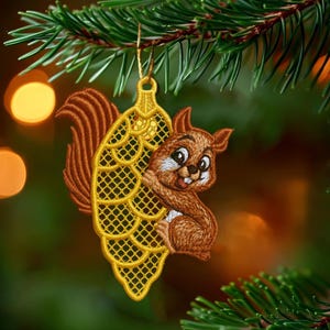 May include: A Christmas tree ornament featuring a brown squirrel hugging a yellow, pinecone-shaped decoration. The squirrel has a white belly and a happy expression. The ornament hangs from a gold string against a blurred background of Christmas lights and evergreen branches.