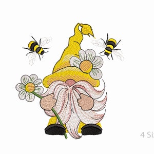 May include: A yellow gnome with a white beard and a yellow hat holding a white daisy. Two yellow and black bees are flying around the gnome.