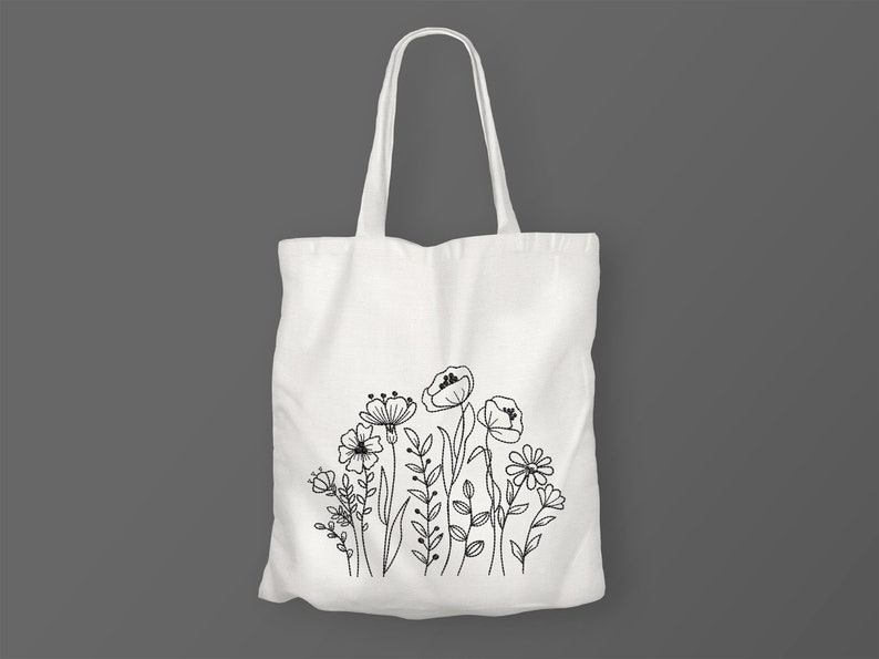 Op de afbeelding: Witte canvas tote bag met een zwarte lijntekening van een boeket bloemen.