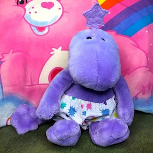 Rare ZWIBBLE DIBBLE GUND dinosaur star baby plush toy with diaper 12” purple Earth's Birthday Project