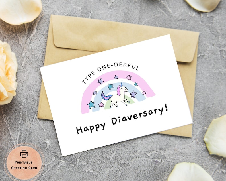 Op de afbeelding: Een printbare kaart met een eenhoorn en regenboog ontwerp. De kaart zegt "Type One-Derful Happy Diaversary!"