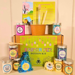 May include: An Easter Fizz Potion Kit with jars of ingredients like sprinkles and bath bombs. The kit includes a mixing bowl, a wooden spoon, and instructions. The box is green and features the text "Easter Fizz Potion Kit". The kit is designed for Easter.