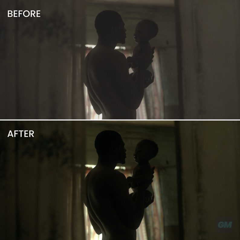 May include: A silhouette of a man holding a baby in a dimly lit room. The man and baby are facing each other, and the man's arm is around the baby's back. The room is dark, with only a few light sources visible.