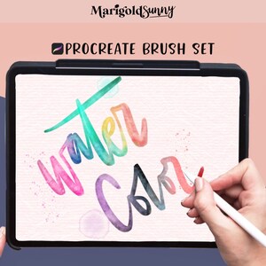 May include: A digital illustration of the word "water color" written in a colorful, stylized font on a tablet screen. The tablet is being used with a stylus to create the artwork. The image is a promotional image for a Procreate brush set.