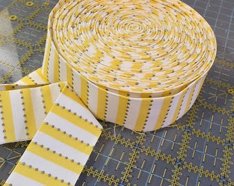 yellow and white with silver dots 2 1/2 inch pressed striped binding for quilts and projects by the yard