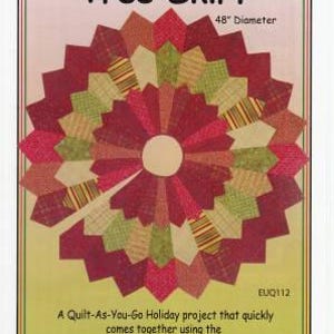 May include: A quilt pattern for a 48-inch diameter tree skirt featuring a triple Dresden design in red, green, and yellow fabrics. The pattern is titled "Triple Dresden Tree Skirt" and includes the text "EUQ112".