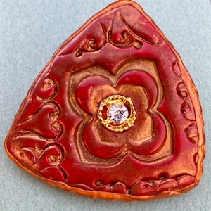 Christmas medieval/looking button. Fancy bejeweled metallic.