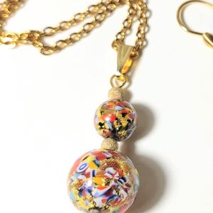 Handmade Murano multicoloured glass luxury jewelry set with genuine gold foil. Set comes with pendant, necklace and matching earrings.