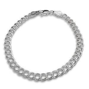 May include: A silver double link chain bracelet featuring a polished finish and a secure lobster claw clasp. The metal links are interconnected in a repeating pattern, creating a continuous circular design with a metallic sheen throughout the piece.