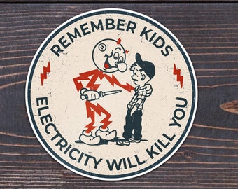 Peut inclure: Un autocollant rond blanc avec un personnage de dessin animé rouge et noir tenant un couteau. L'autocollant porte le texte "Remember Kids Electricity Will Kill You" autour du bord.