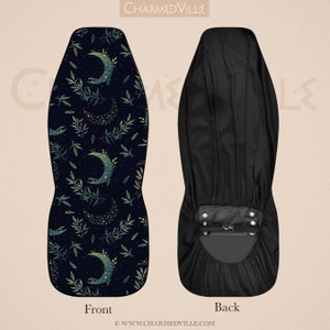 May include: A black and green patterned chair seat cover with a crescent moon and stars design. The back of the cover is plain black.
