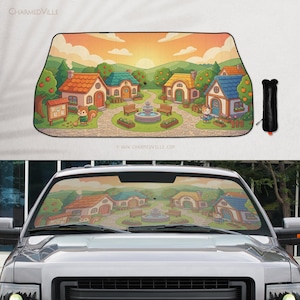May include: A car windshield sunshade featuring a cartoon village scene with colorful houses, trees, and a fountain. The design includes a squirrel and cat character. The sunshade is black and rolls up for storage.