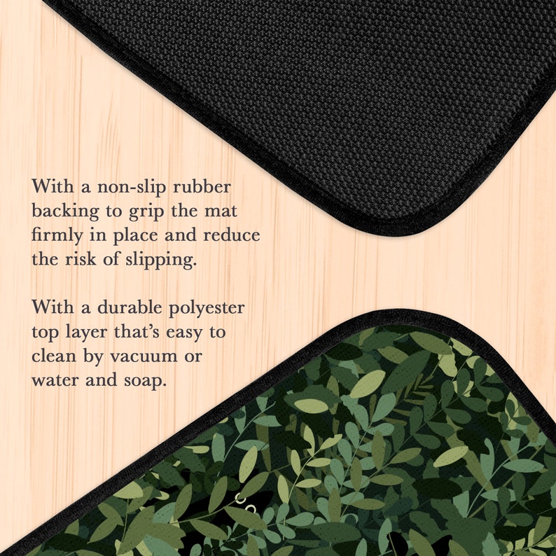 May include: A black and green floor mat with a non-slip rubber backing and a durable polyester top layer. The mat features a leafy pattern.