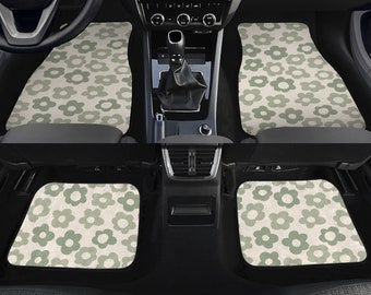 May include: Set of four car floor mats with a green and white daisy pattern. The mats are made of a durable material and are designed to protect your car's interior.