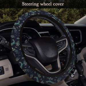 May include: A black steering wheel cover with a green and white floral pattern. The cover is made of a soft, comfortable material and is designed to protect your steering wheel from wear and tear.