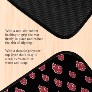 May include: Black and red floor mat with a repeating pattern of red clouds. The mat has a non-slip rubber backing and a durable polyester top layer.