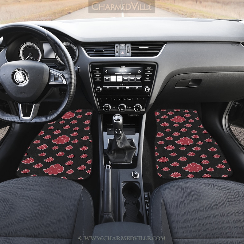May include: Black car floor mats with a red cloud pattern. The mats are in the front passenger and driver's side of the car. The mats are made of a soft, durable material and are easy to clean.