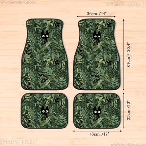 May include: Set of four car floor mats with a green leafy pattern and black cat faces peeking out. The mats measure 14 inches by 17 inches and 13 inches by 26.4 inches.