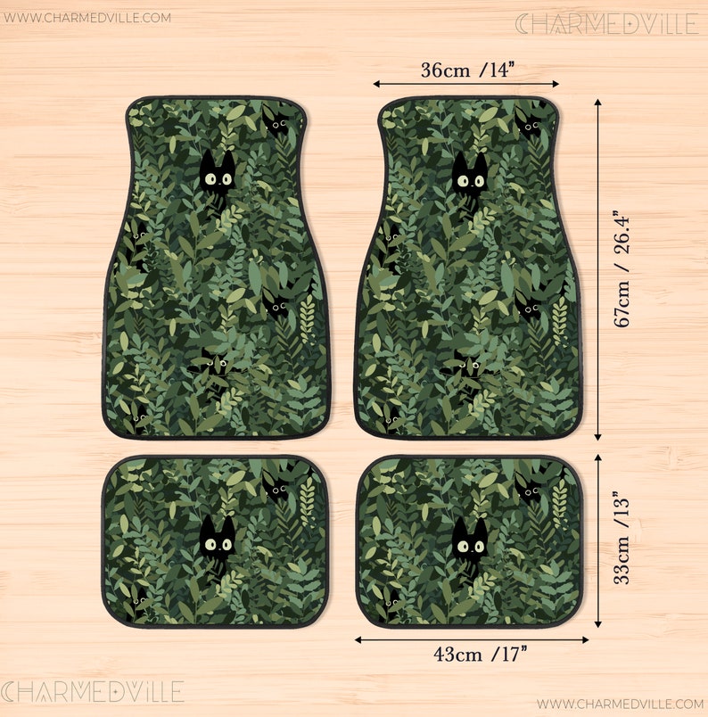 May include: Set of four car floor mats with a green leafy pattern and black cat faces peeking out. The mats measure 14 inches by 17 inches and 13 inches by 26.4 inches.
