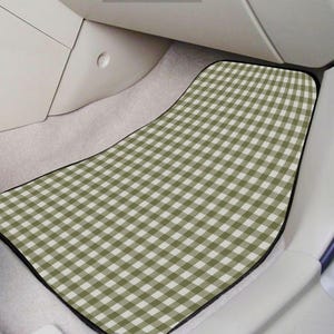 May include: A car floor mat featuring a sage green and white gingham check pattern. The mat has a contoured shape with rounded corners and a black border, designed to fit the footwell area of a vehicle interior with light-colored carpeting.