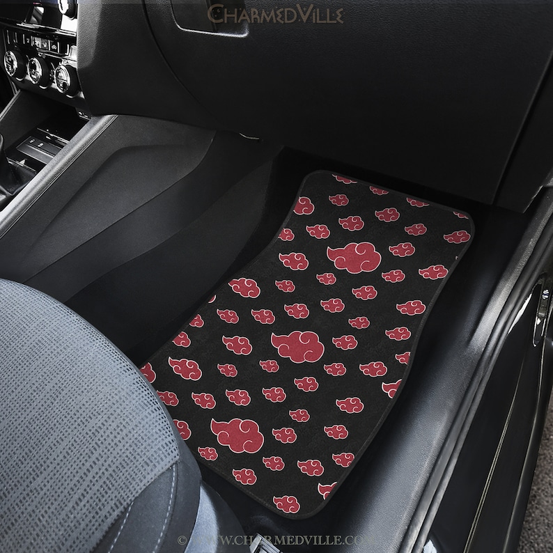 May include: Black car floor mat with a red cloud pattern. The mat is made of a soft, plush material and is designed to protect your car's interior from dirt and wear.