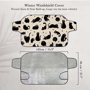 May include: A winter windshield cover with a black cat pattern on a beige background. The cover is 55.9 inches wide and 37.7 inches high, designed to prevent snow and frost buildup on most vehicles. The text on the image says "Winter Windshield Cover" and "Prevent Snow & Frost Built-up. Large size for most vehicles!"