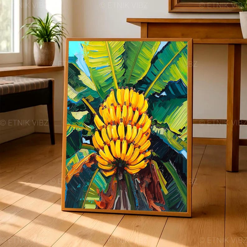May include: A framed art print featuring a vibrant painting of a bunch of ripe yellow bananas. The bananas are surrounded by large green banana leaves, with a blue sky peeking through. The artwork is in a wooden frame.