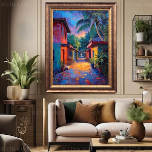 Pu&ograve; includere: Un dipinto a olio incorniciato raffigura una vivace scena di strada con edifici colorati e palme. L'opera d'arte presenta una calda tavolozza di arancioni, blu e gialli, con una cornice dorata. Il dipinto &egrave; esposto in un soggiorno.