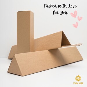 May include: Cardboard packaging boxes in various shapes and sizes. The boxes are a light brown colour and are arranged on a white surface. Text on the image reads "Packed with Love for You" with pink heart illustrations.