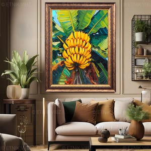 May include: A framed painting depicting a cluster of yellow bananas set against lush green foliage. The artwork is encased in a gold-toned frame and displayed on a neutral wall. The painting is a central feature in a living room setting.