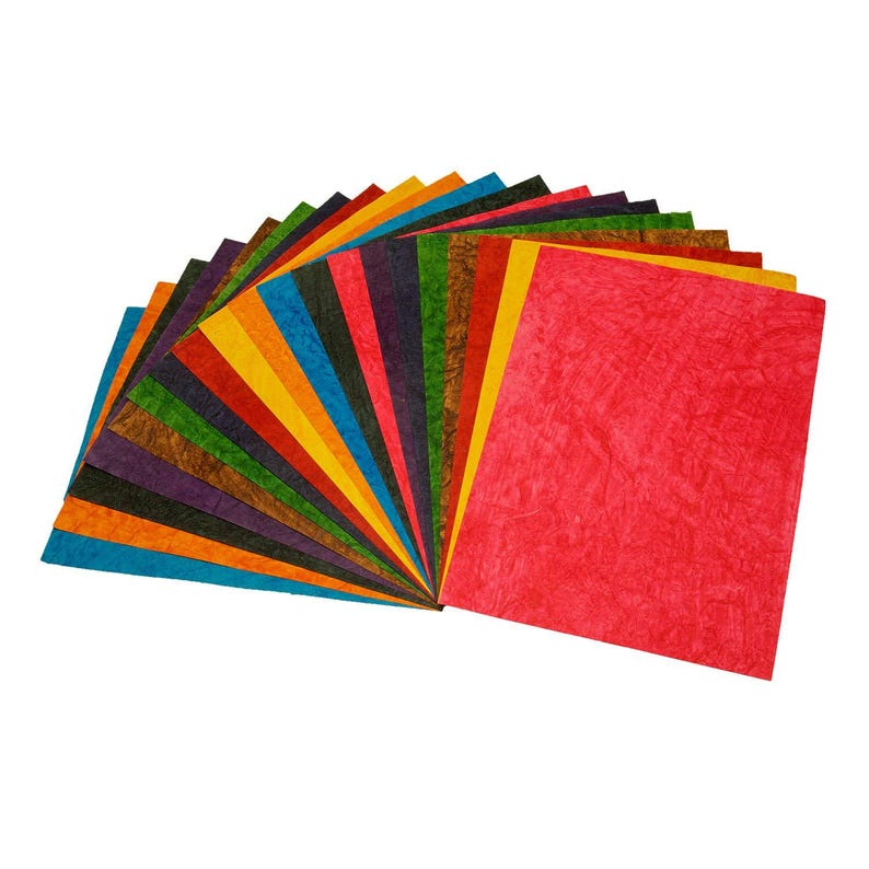 May include: A selection of textured paper sheets in a fan arrangement, showcasing a spectrum of colours. The sheets include red, orange, yellow, green, blue, and purple. The paper has a distinctive, crinkled texture.