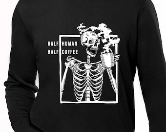 May include: Black long-sleeved sweatshirt featuring a white skeleton graphic holding a coffee mug. The text "HALF HUMAN HALF COFFEE" is printed on the sweatshirt.