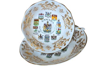 Taza y platillo de porcelana fina vintage de Paragon Canada, con el escudo de armas canadiense, de la década de 1950.