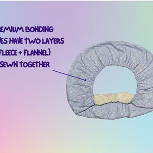 May include: A light blue, floral-patterned scarf with a fleece and flannel interior. The text reads "Premium Bonding Scarves Have Two Layers (Fleece + Flannel) Sewn Together."
