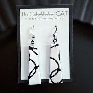 Mod, black and white geometric pattern polymer clay earrings