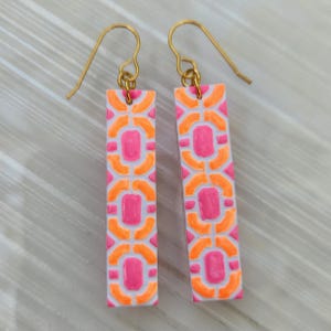 Bright neon pink and orange tile patterened polymer clay dangle earrings