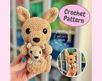 May include: Crochet pattern for a brown amigurumi kangaroo holding a smaller brown kangaroo joey. The pattern is called "Jenn's Crafty Creations".