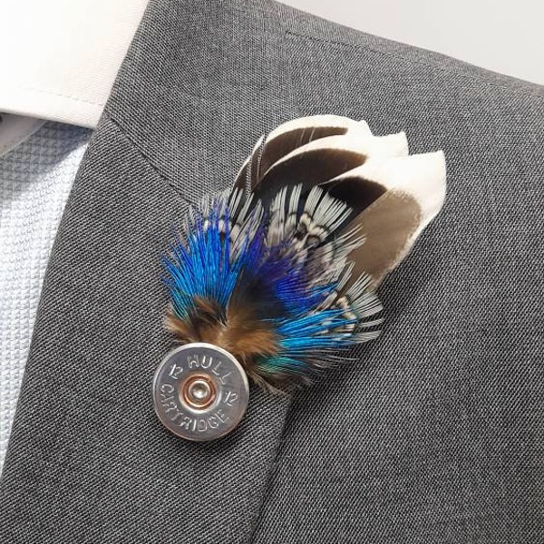 Handcrafted natural blue feather silver tone shotgun shell lapel pin hat pin brooch