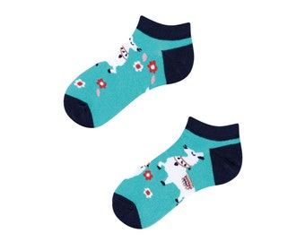 May include: A pair of turquoise blue ankle socks with a white llama design and red flowers. The socks have a navy blue heel and toe.
