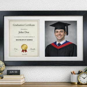 May include: A black framed graduation certificate and photograph. The certificate is for a Bachelor of Science degree, awarded to John Doe. The photograph shows a smiling graduate in cap and gown.
