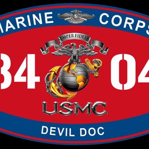 May include: A red, white, and blue Marine Corps emblem with the text "MARINE CORPS" at the top and "DEVIL DOC" at the bottom. The emblem features the numbers "84" and "04" in white, along with an eagle, globe, and anchor.