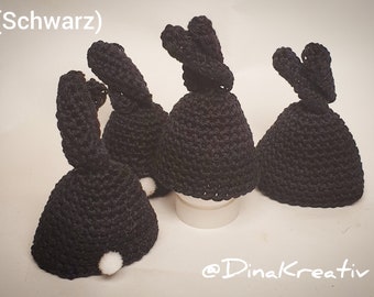 Set of four cotton egg cozies in bunny shape.