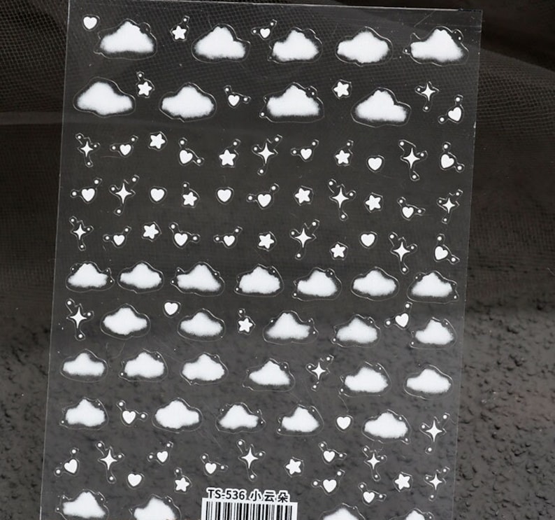 May include: A sheet of clear sticker paper with white cloud, star, and heart stickers. The sheet has the text "TS-536 小云朵" printed on it.