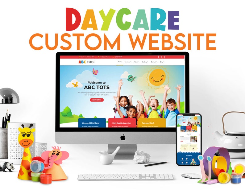 May include: A computer monitor and smartphone showcasing a daycare website design, with the text "DAYCARE CUSTOM WEBSITE" at the top. The website features images of children and the words "ABC TOTS". Decorative paper crafts and art supplies are in the foreground.